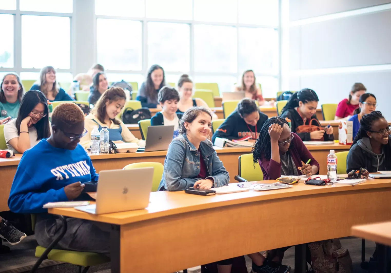 students in classroom taking notes