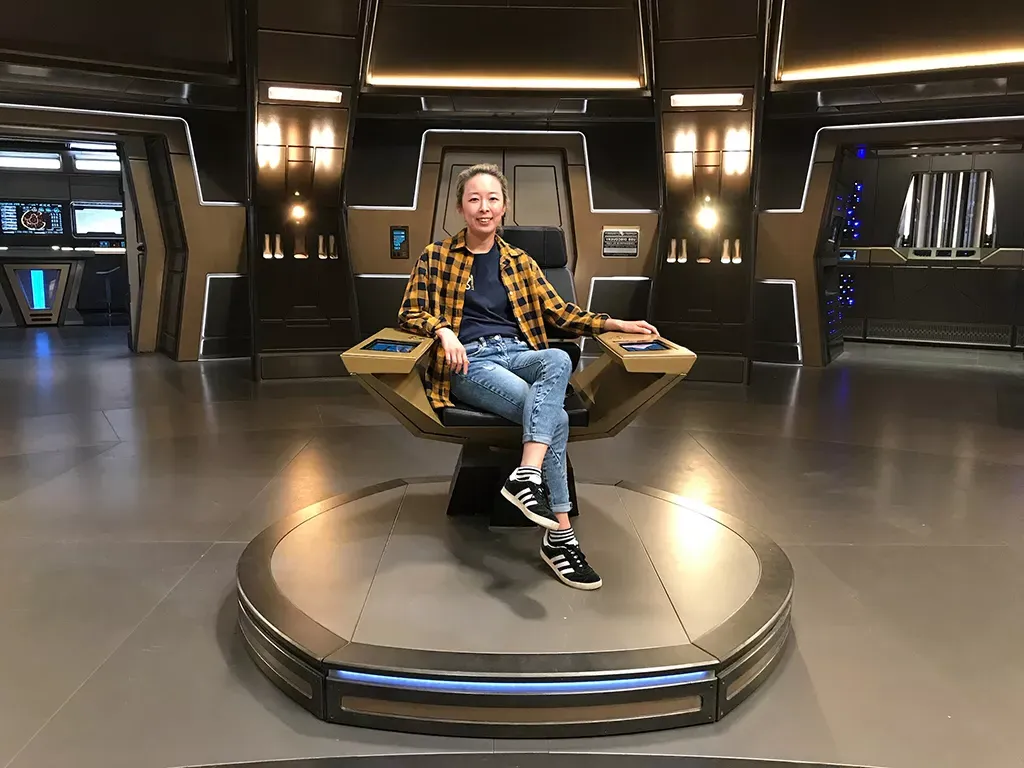 Bo Yeon in the Captain's chair on the set of Star Trek: Discover